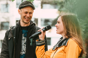 Artist Teemu Mäenpää being interviewed by hostess Anna Elina Isoaro @ the unveiling of the Tree of Poetry mural. Photo by Riikka Vaahtera