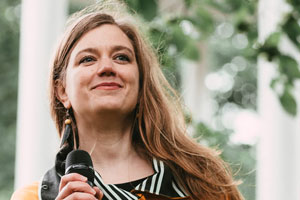 The hostess Anna Elina Isoaro @ the unveiling of the Tree of Poetry mural. Photo by Riikka Vaahtera